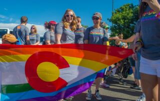 Participants In The Pridefest Parade Make Their Way Through Downtown Denver Credit Evan Semon